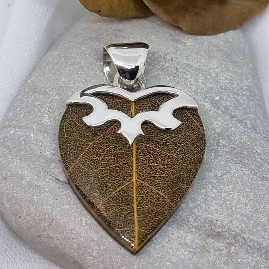 Heart shaped brown skeleton leaf pendant