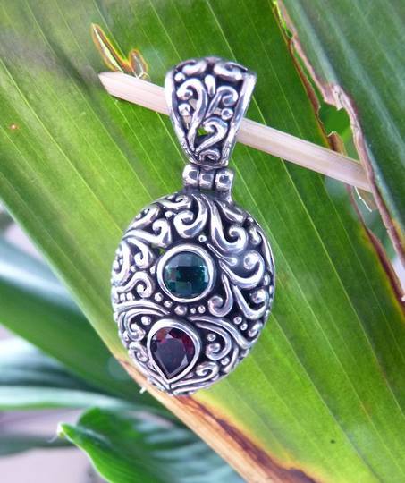Heavy sterling silver carved pendant with gemstones