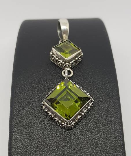 Double hanging silver peridot pendant with filigree frame