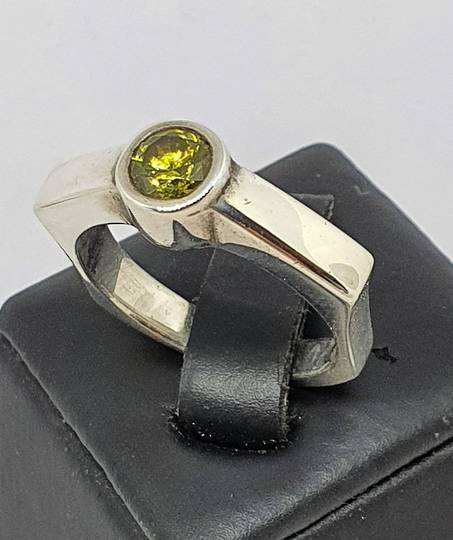 Sterling silver ring with single green gemstone