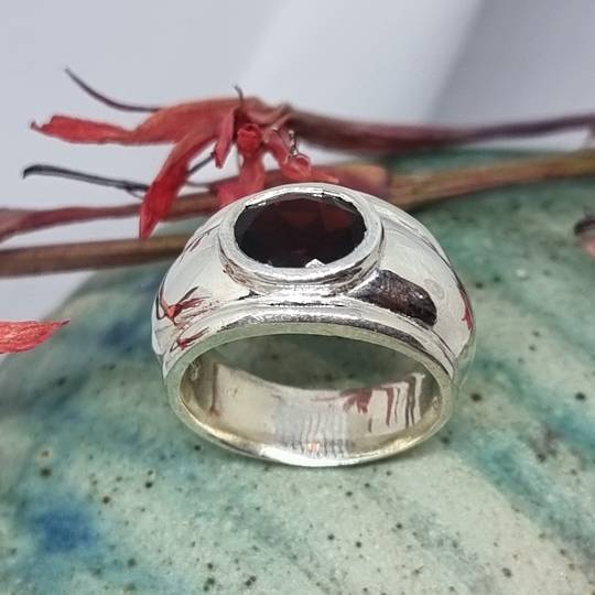 Sterling silver wide band ring with garnet