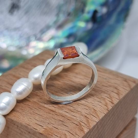 Silver ring with square orange gemstone gemstone