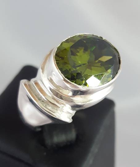 Large oval green gemstone silver ring