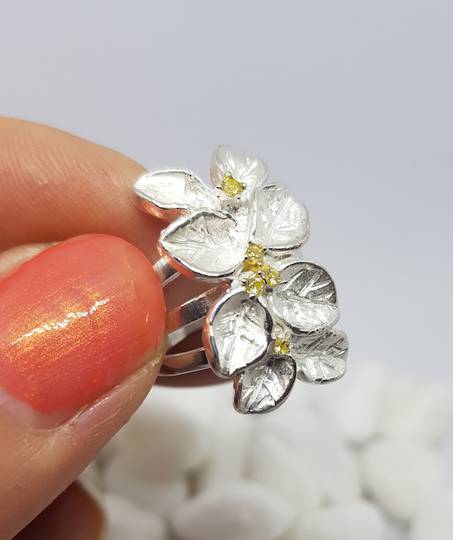 Sterling silver flower ring with tiny gemstones