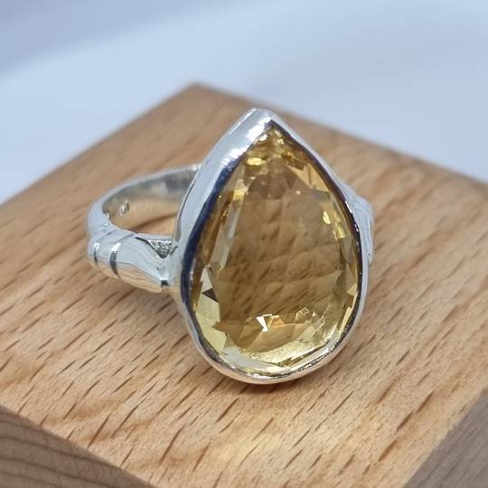 Sterling silver ring with sparkling golden gemstone