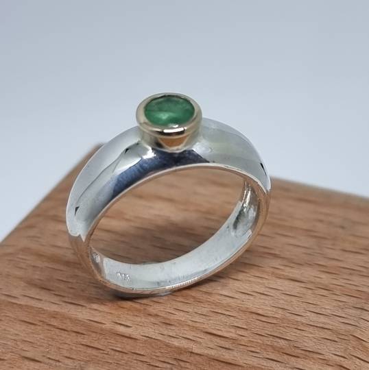 Silver ring with natural emerald in 9ct gold setting