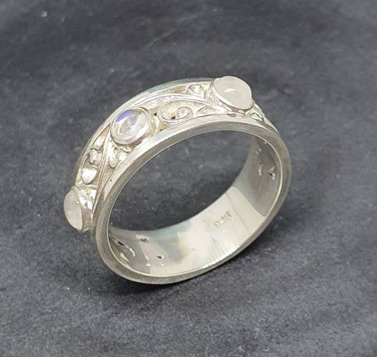 Sterling silver moonstone ring with koru swirls