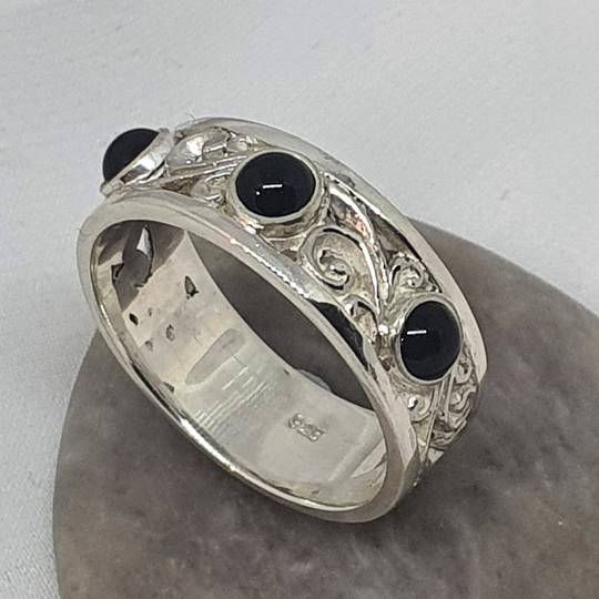 Sterling silver black onyx ring with koru swirls