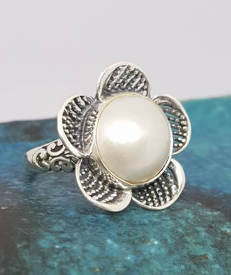Sterling silver white pearl ring in a flower design - size P