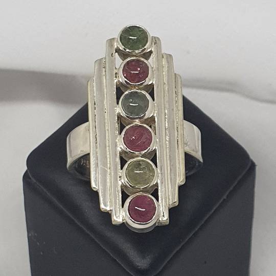 Long rectangle ring with green and red gemstones
