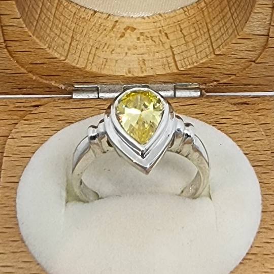 Silver ring with golden sparkling cz stone