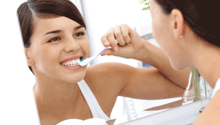 female-brushin-teeth