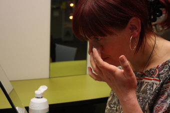 Woman Putting On Contact Lenses 